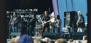 John Fogerty on stage with Jerry Garcia and Bob Weir